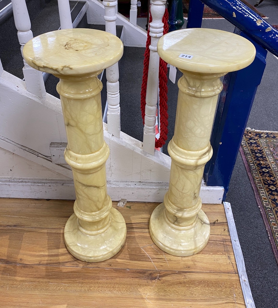 A pair of alabaster pedestals, height 78cm